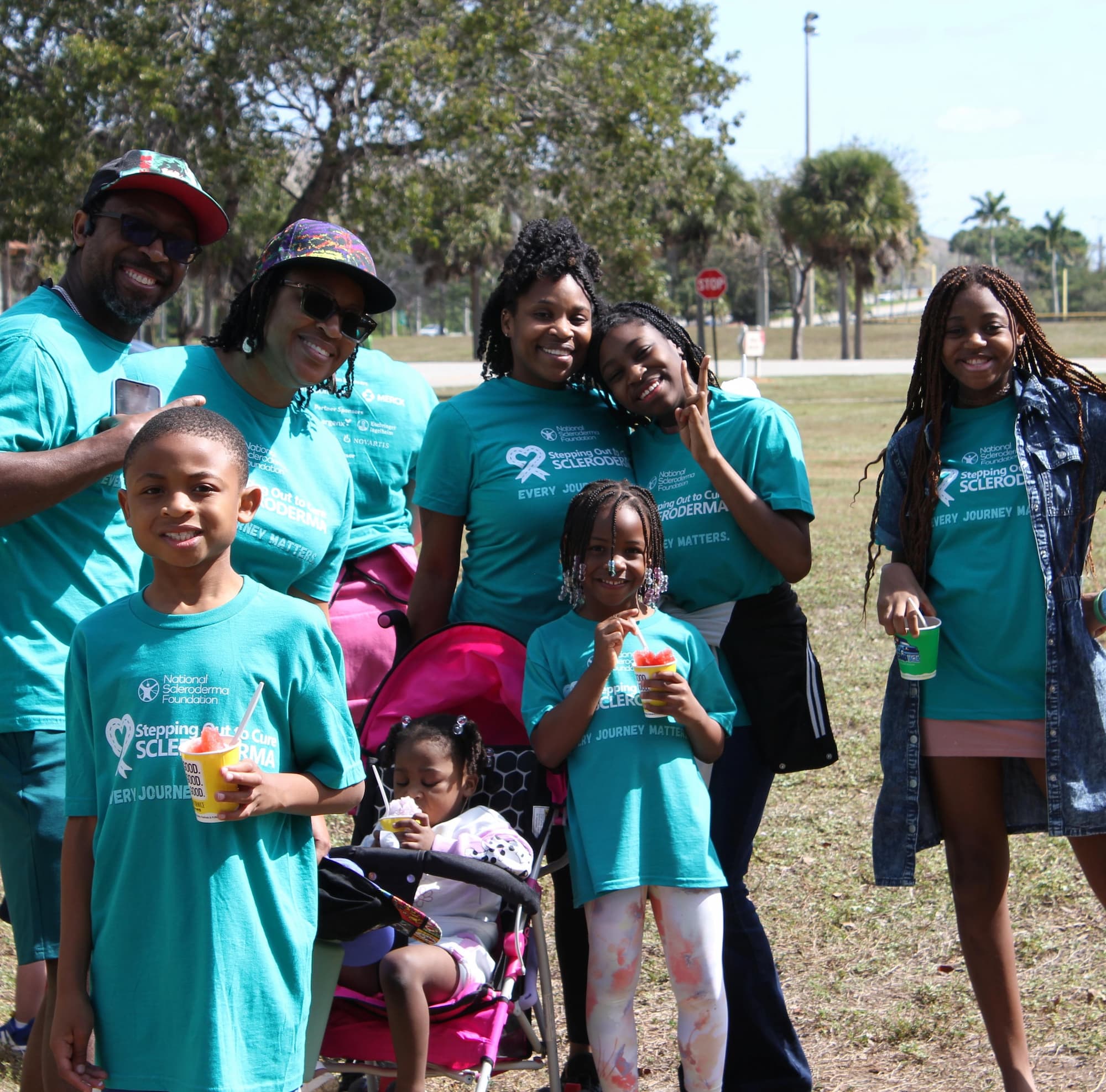Family at event wearing Stepping Out t-shirts